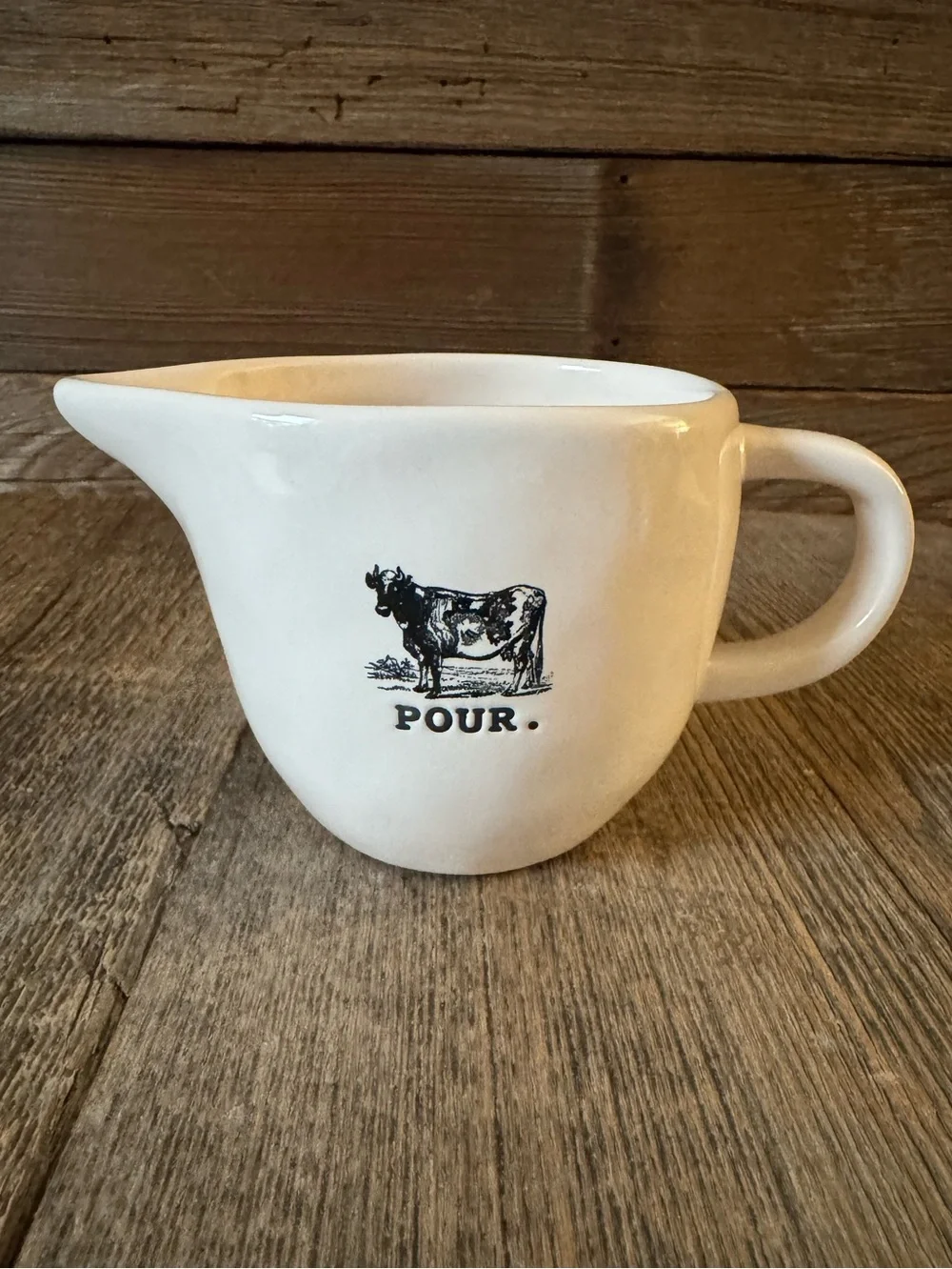 Rae Dunn “Pour.” Ceramic creamer with Cow Graphic